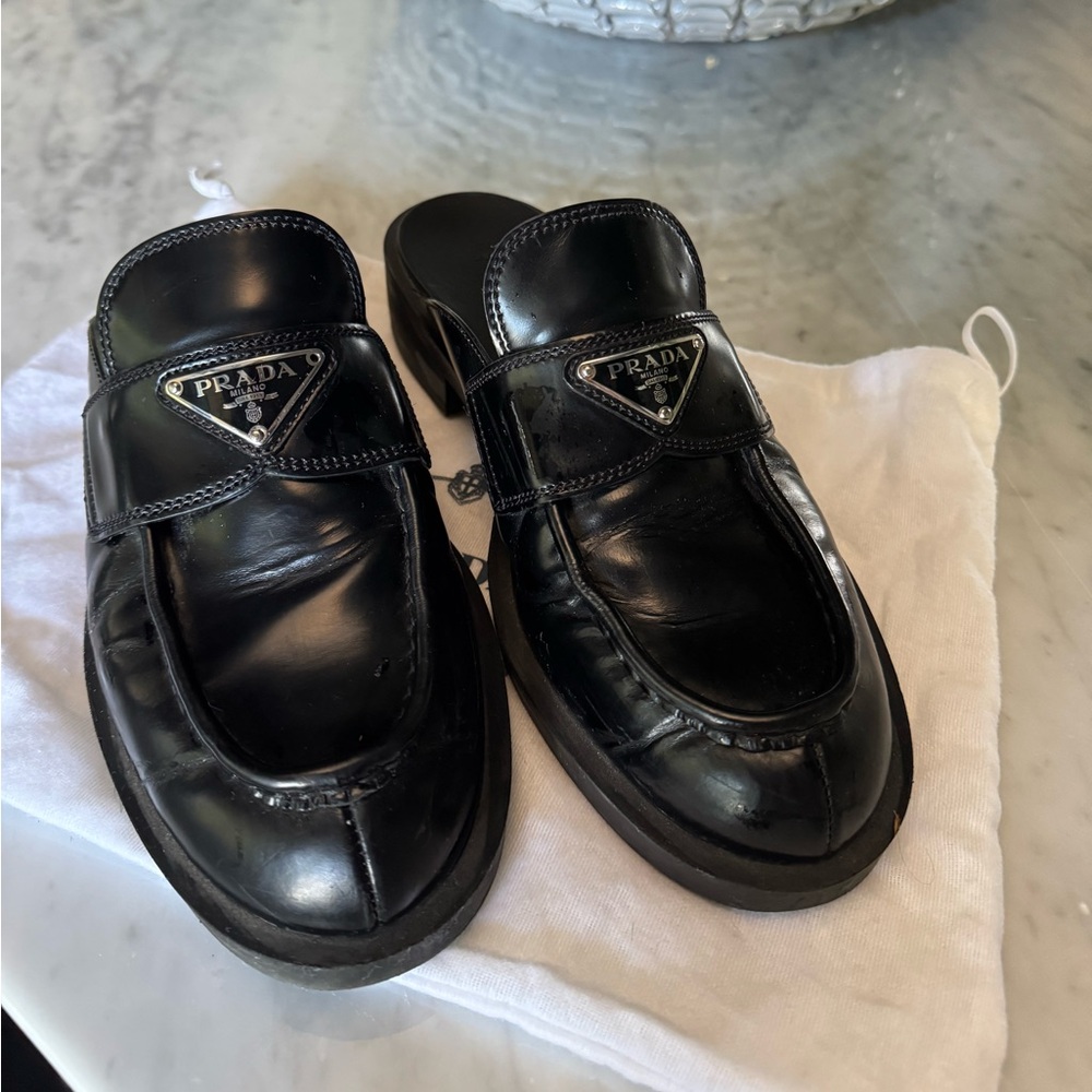 Black leather Prada mules